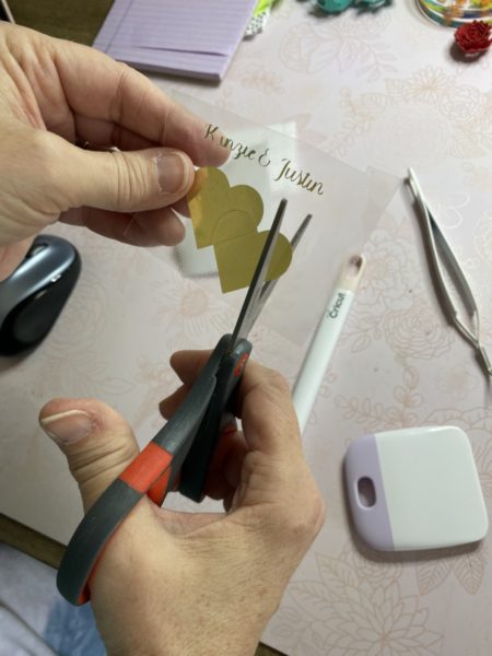 Person cutting slits in adhesive foil